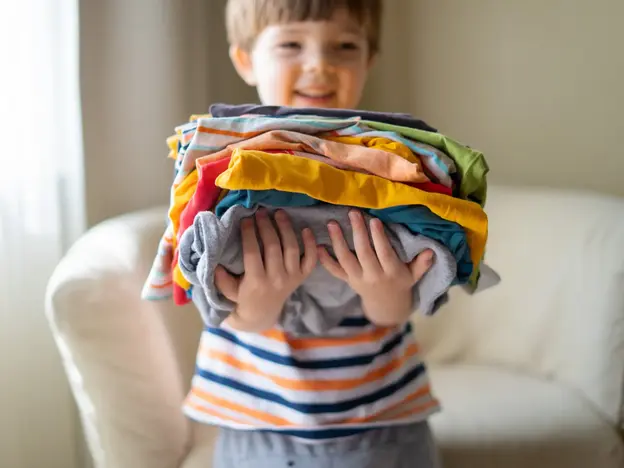 Kids with clothing stacked